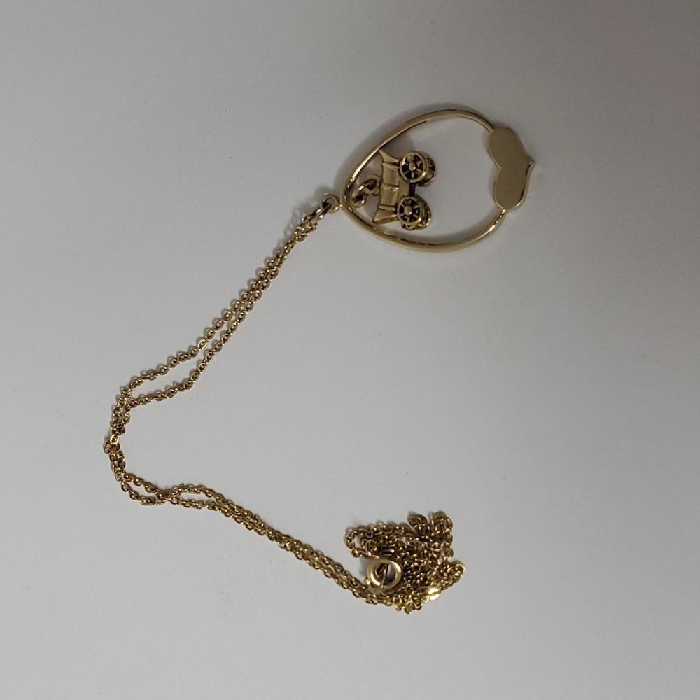 Gold tone wagon and heart necklace